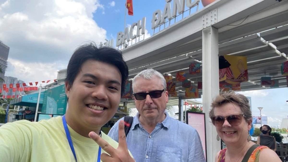Local Saigon walking tour guide meeting guests at Bach Dang Wharf, the starting point of our free walking tours